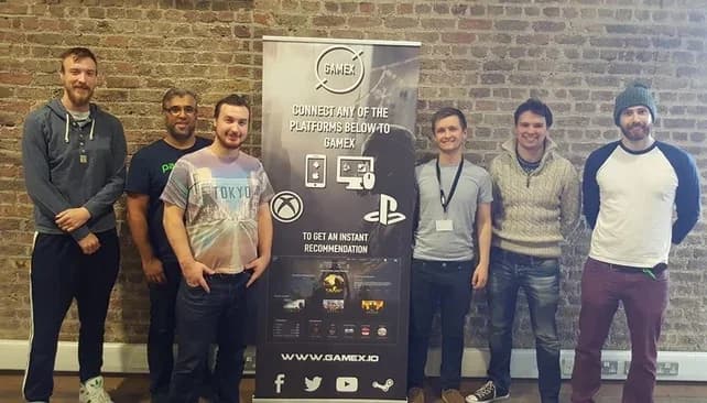 The GameX team, circa 2016, beside the GameX 'connect any platform to get an instant recommendation' pull-up banner.